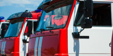 Car pool with fire engines of fire department